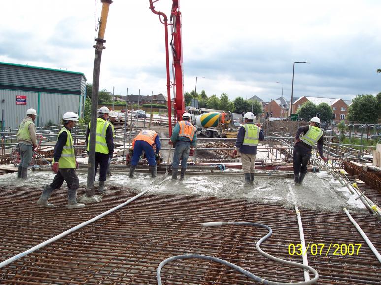 Concrete being placed to the deck