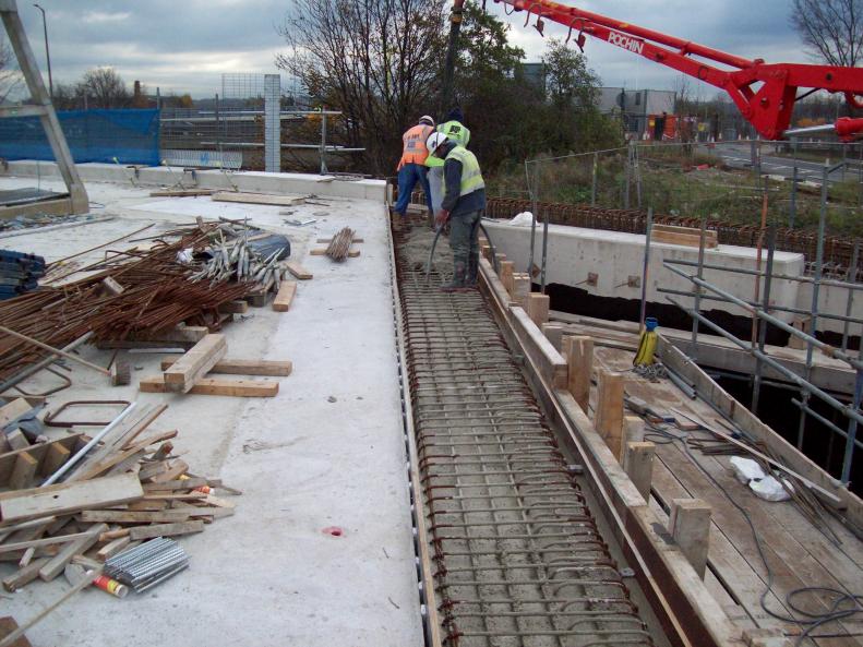 Screen wall capping section being concrete to create the expansion joint.