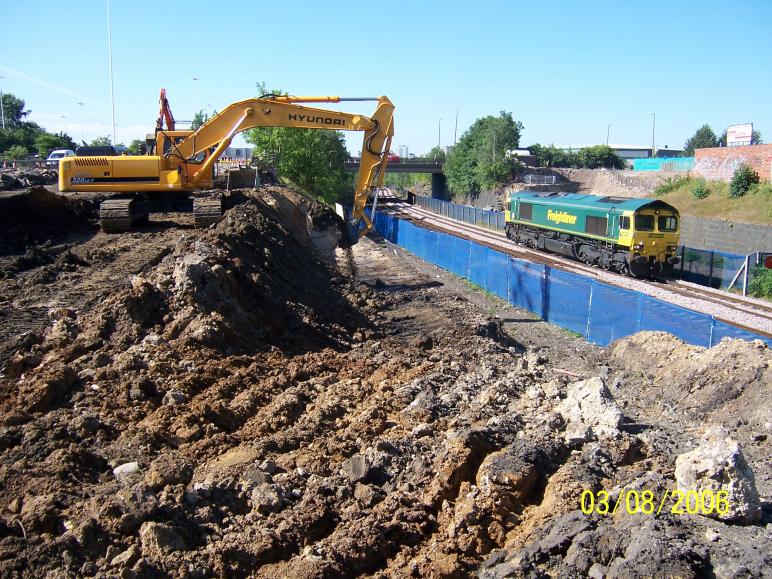 South Abutment being excavated out with the trains running.