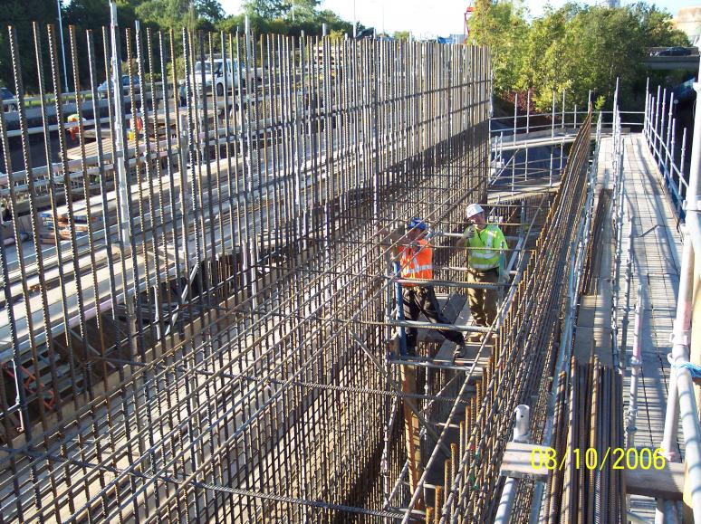 Steel being fixed from inside the wall - Paul Hanson fixing the steel.