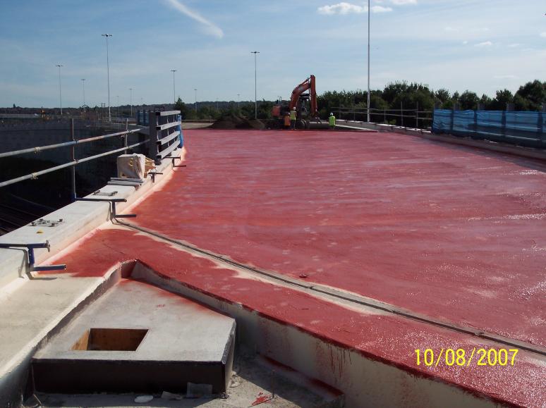 Deck waterproofed and access manhole lid cast.