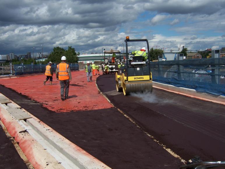 Red Sandcarpet being laid on the deck.