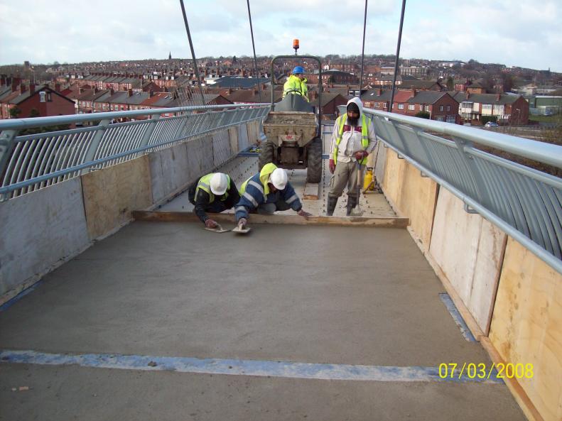 Concrete to bridge deck