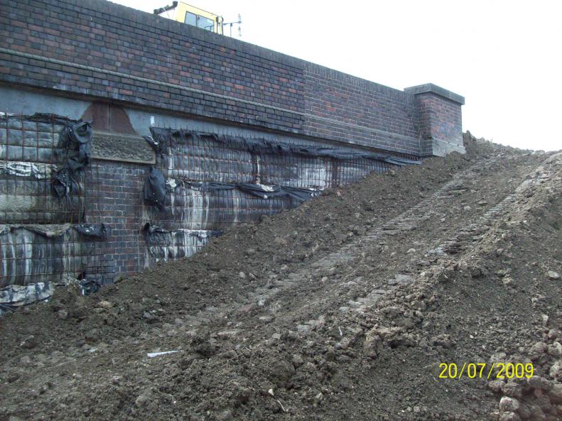 Backfilling around the underfilled structure 