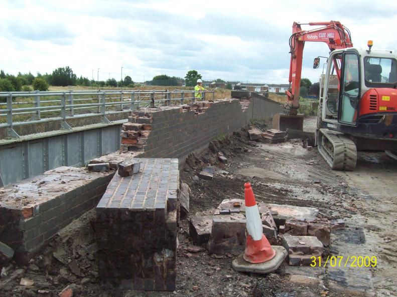 Brick Parapet being pulled over from the bridge deck