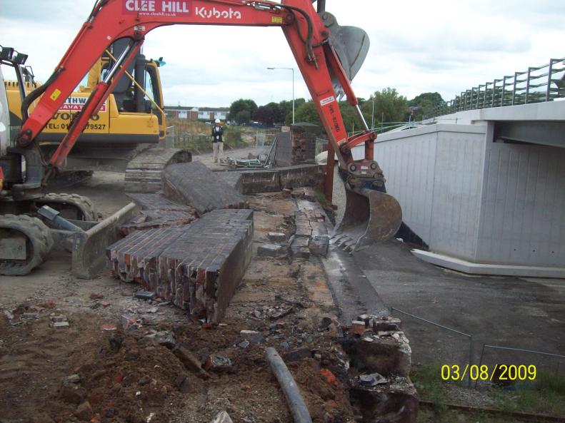 A small tug and the wall falls over very controlled not one brick on the track below.