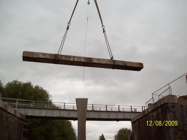 Beam lifted clear from the top of the trestles