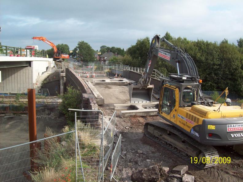 Braithwaite Demolition clearing trestles of the bridge as Ivor King finish and move away.