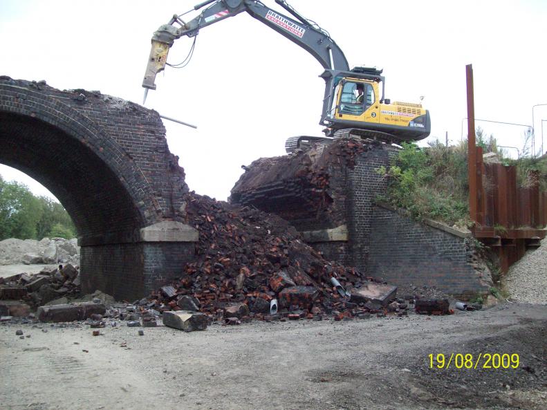 Arch span being broken down