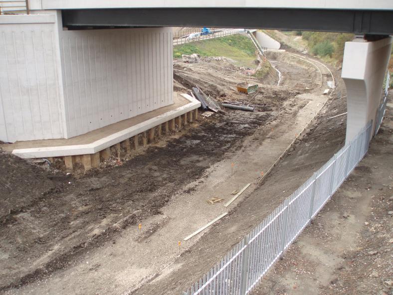 Fence being installed between the canal and the railway.