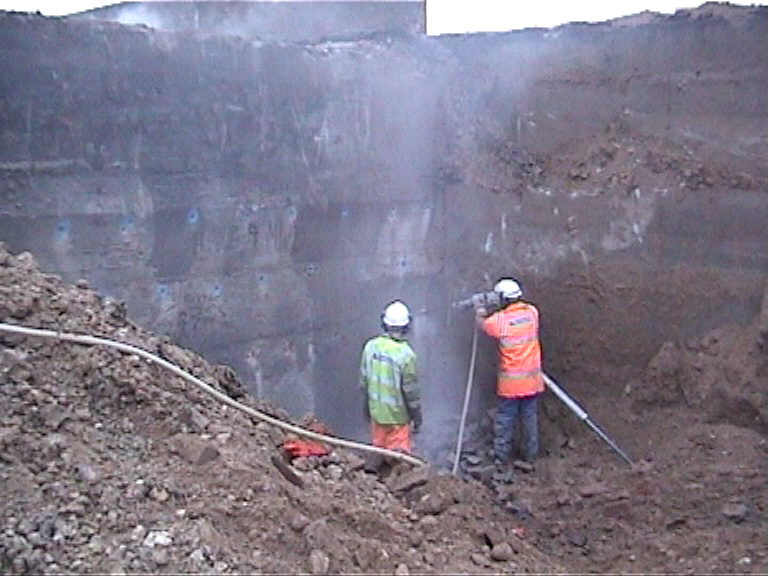 Abutment being drilled ready for charges