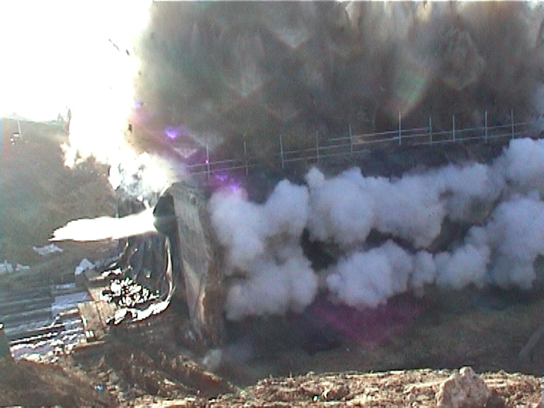 Abutment charges detonate