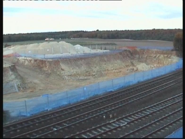 North abutment fence erected + crushed stone stockpiled